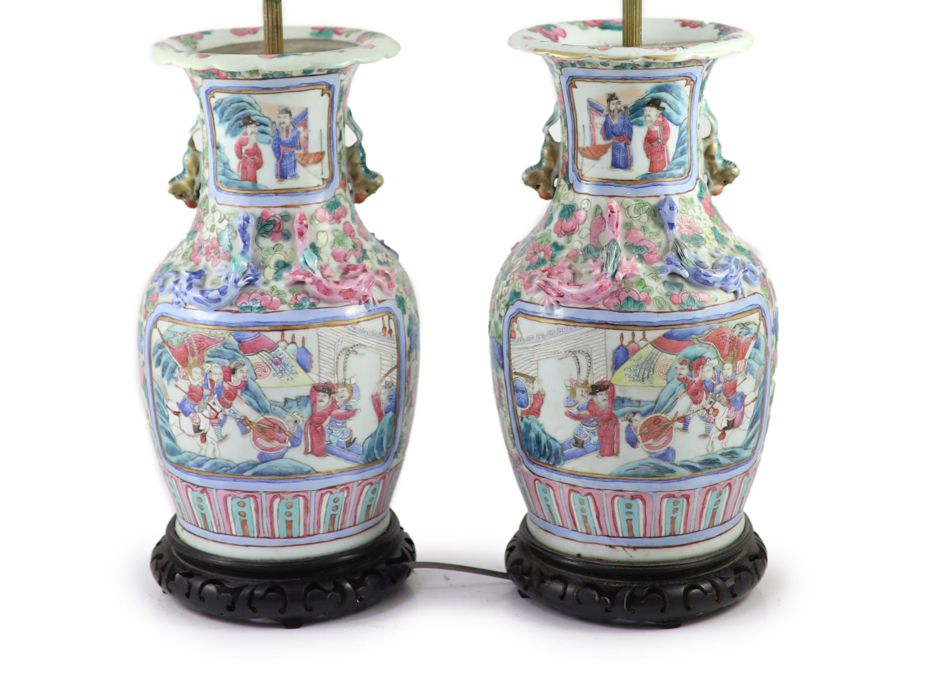 A pair of 19th century Chinese famille rose baluster vases, fitted as table lamps, on hardwood stands